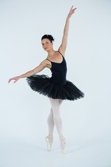 Obraz premium Ballerina practicing ballet dance