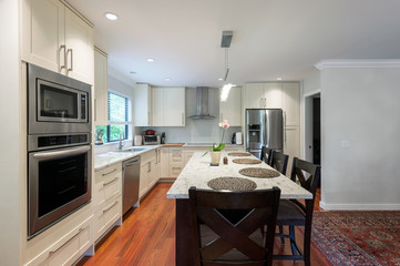 Modern kitchen interior with stainless steel appliances in a luxury house.