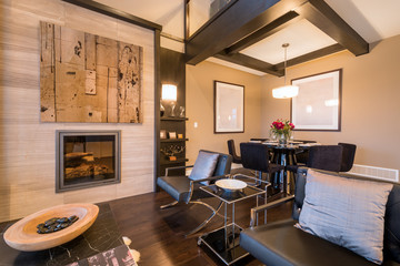 Modern bright living room with fireplace and sitting area. Interior design.