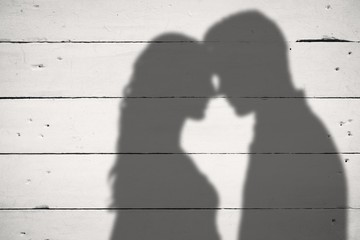 Composite image of young couple rubbing nose