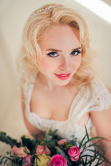 Beautiful bride holding flowers, summertime wedding