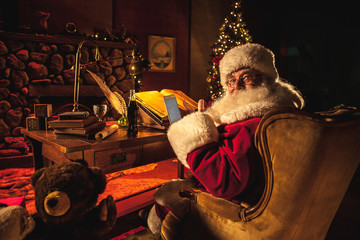 Santa Claus double checks his Naughty List against Tindr.
