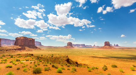 Desert, red sandstone mountains cloudy sky