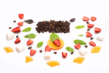 strawberry, marshmallows, coffee beans and orange dessert isolated on white