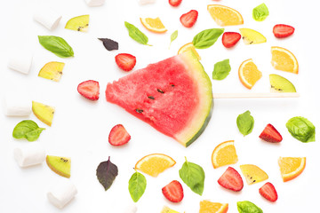 watermelon, strawberry, leaves, kiwi and orange isolated on white