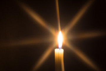 candle and candlelight with black background