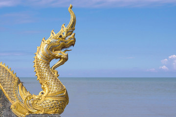 Naga at buddhism temple in blue sky.