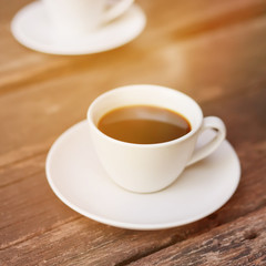 Cup of hot espresso coffee with vintage tone.