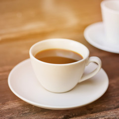 Cup of hot espresso coffee with vintage tone.
