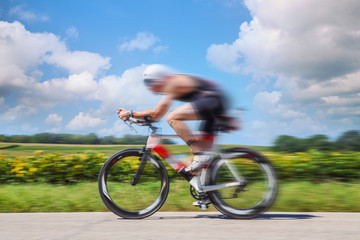 Fototapeta na wymiar Racing Cyclist. Motion blurred image