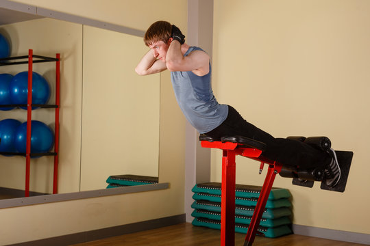Man doing exercises for back. Healthy lifestyle concept. Fitness.