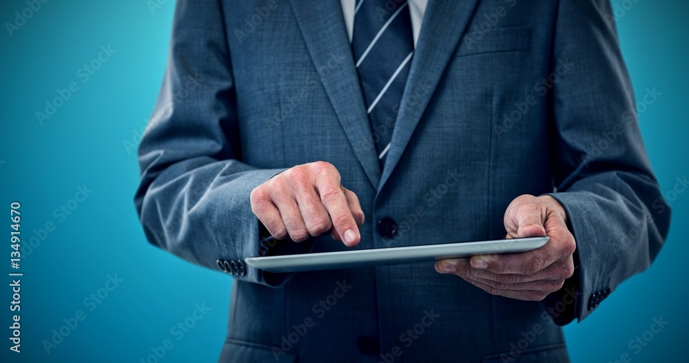 Poster composite image of businessman using digital tablet