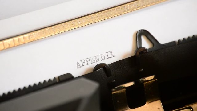 Typing the word Appendix with an old manual typewriter