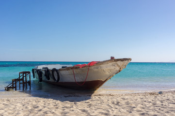 A boat moored to the shore. Beautiful view from the Paradise Island near Hurghada to Red Sea