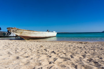 A boat moored to the shore. Beautiful view from the Paradise Island near Hurghada to Red Sea