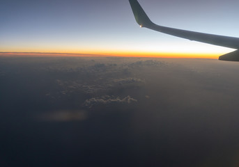 A view from the airplane window, sky in the beautiful sunset