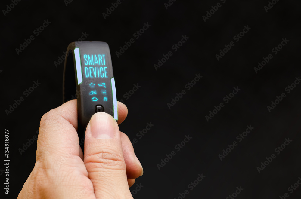 Aufkleber close up hand holding smart watch to control feature with blank