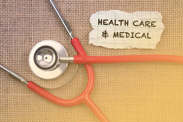 Stethoscope and paper with word Health Care & Medical. Medical Concept