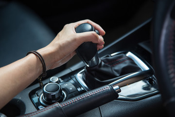 girl driving car moving transmission shift gear
