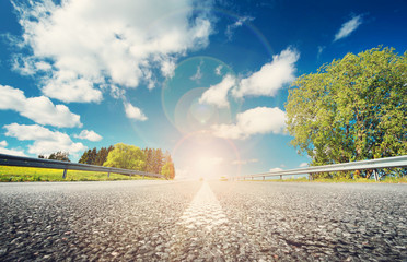 asphalt road in beautiful spring day at countryside with sunlight