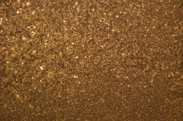 unusual patterns of frost on a window at sunset