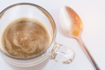 Hot coffee with teaspoon