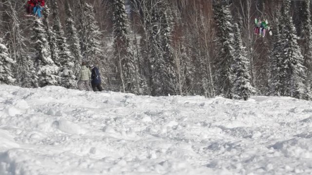 instructor teaches the skier to ride on a mountain top