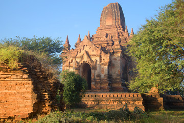 Fototapeta na wymiar The ruins of the ancient Buddhist temple in the morning sun. Bagan, Myanmar