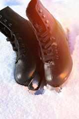 Ice skates in the snow