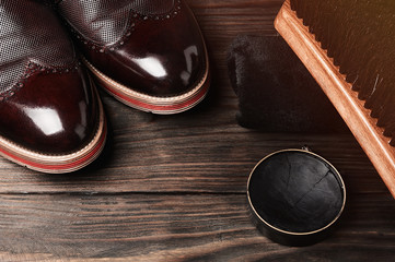 leather shoes on table with polishing equipment. Fashion handmade. Wax