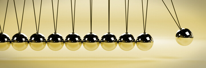 cause and effect concept banner, metal Newton's cradle in a vintage style scene