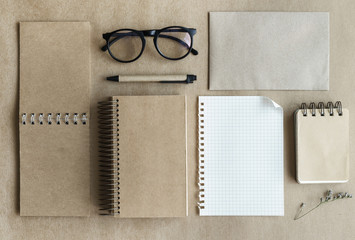 Recycle notebook with notepaper on desk office, Top view