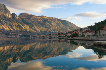 Fototapeta na wymiar Reflections in water. Seaside Prcanj town, Montenegro