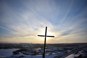 Orthodox cross on the hill against the evening sky