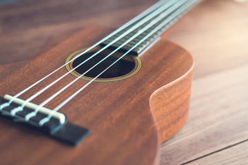 Ukulele guitar on wooden table
