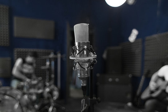 Professional Studio Microphone with Blurred Recording Studio Background