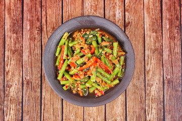 Spicy fried cowpea with minced pork call Pad Ped Tua.