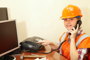 Young contractor on the phone in the office