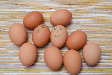 Chicken eggs in the straw tablecloth background