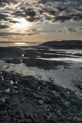 Sunset reflection in water and rocky view in Saint-Malo, France
