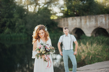 The bride and groom in nature. Rustic Wedding