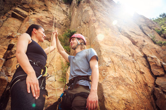 Young Climbers Rock Climbing In Old Quarry