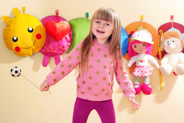 The four-year girl playing and learning in kindergarten