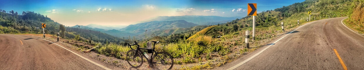 riding a bicycle on hill.