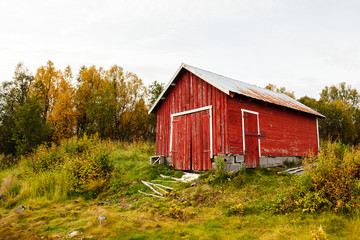 Tipical Red house near the sea coast in Norway