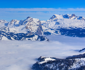Alps in winter, view from Mt. Fronalpstock in the Swiss canton of Graubunden