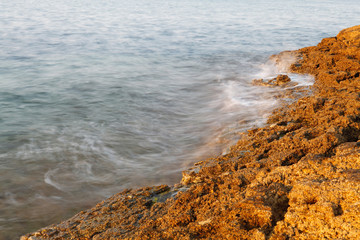 Aegean shore in Greece, Thassos island - waves and rocks - long exposure photography
