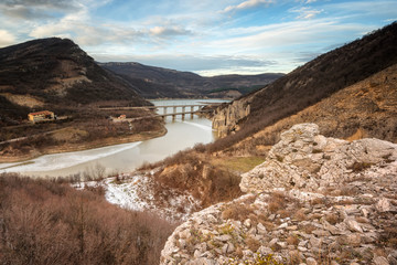 Winter lake and Wonder Rocks /
Winter day view with the bridge over the Tzonevo dam and the famous rock formation Wonder Rocks, Bulgaria