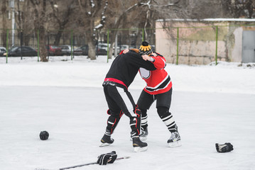 two hockey players fighting for the right to own washer