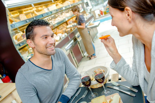 Couple having meal in cafe